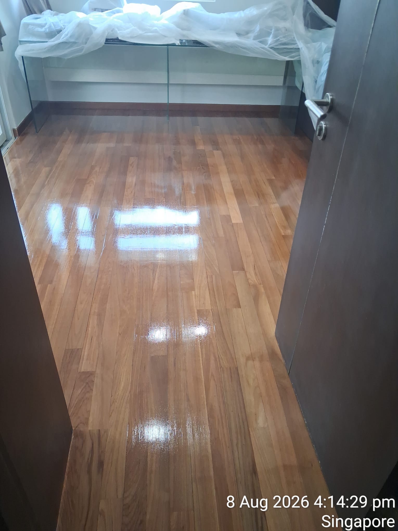 Interior parquet floor finished with clear protective varnish